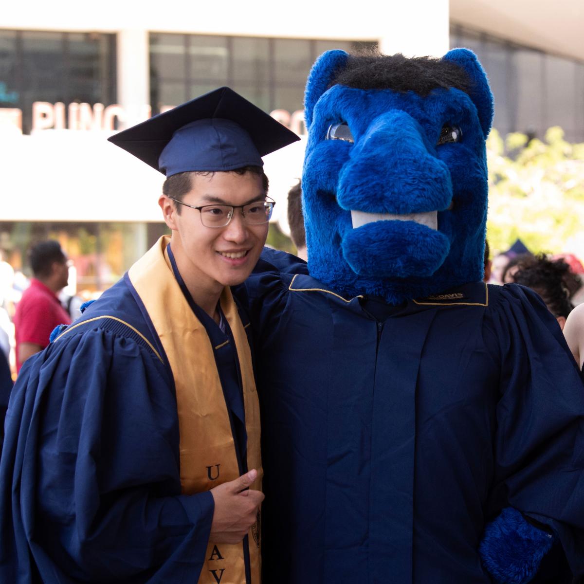 Graduates attend the commencement ceremony at the Golden 1 Center in Sacramento on June 14, 2024.  Gunrock visits with graduates and their families.