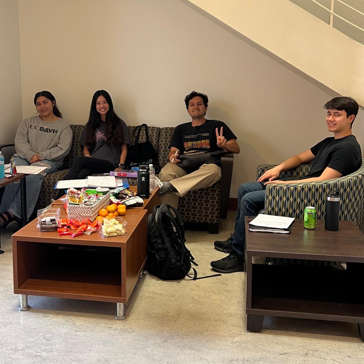 CBS students Cynthia, Serena, Ethan, and Nico enjoying snacks outside of the Dean's Office in Green Hall while studying for spring quarter finals.