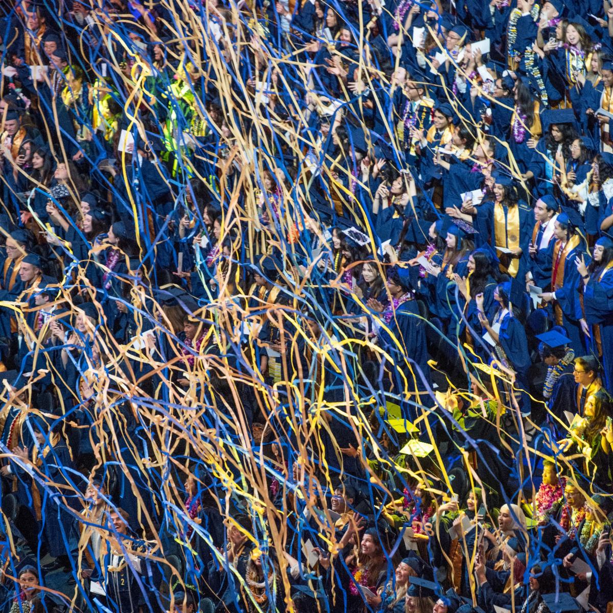 The new graduates are showered with streamers and confetti at the end of the commencement ceremony, as seen from above,  on June 15, 2024.