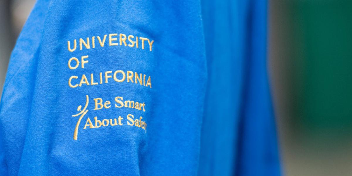 embroidery on a shirt that reads be smart about safety