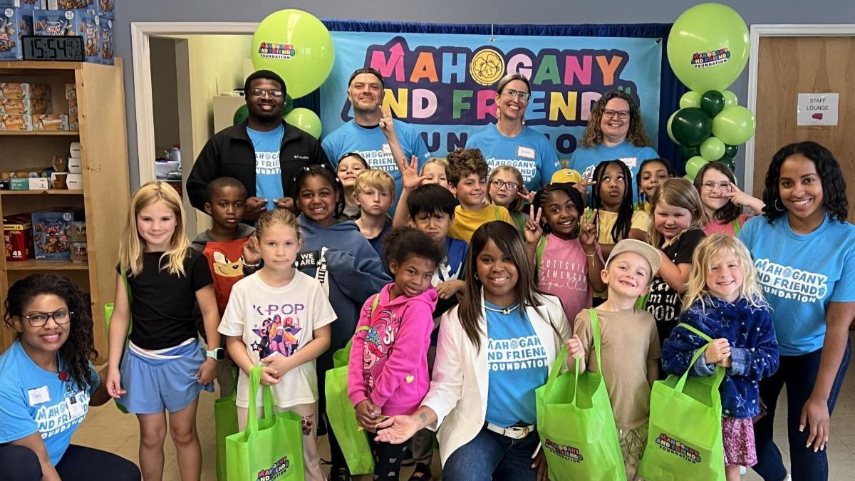 Volunteers and Children at Children's Financial Literacy Event