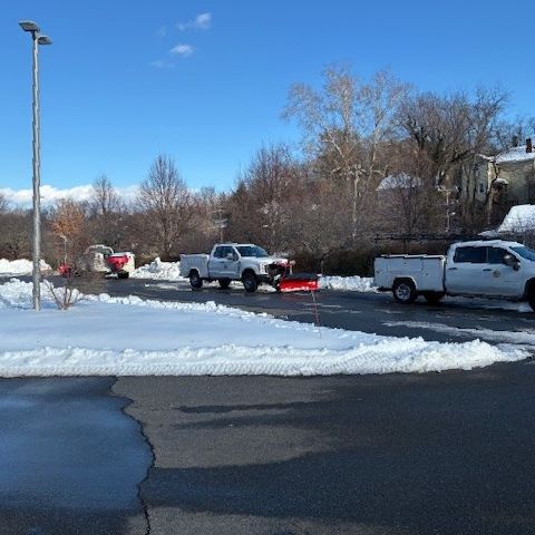 County crews clearing snow outside county office i 2026building