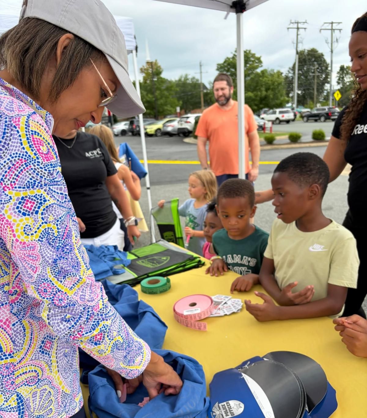 NNO 2026 - Children participating with vendors on site at activity table