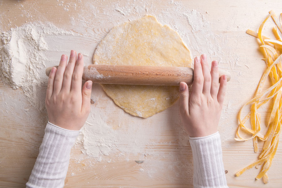 person making fettuccine