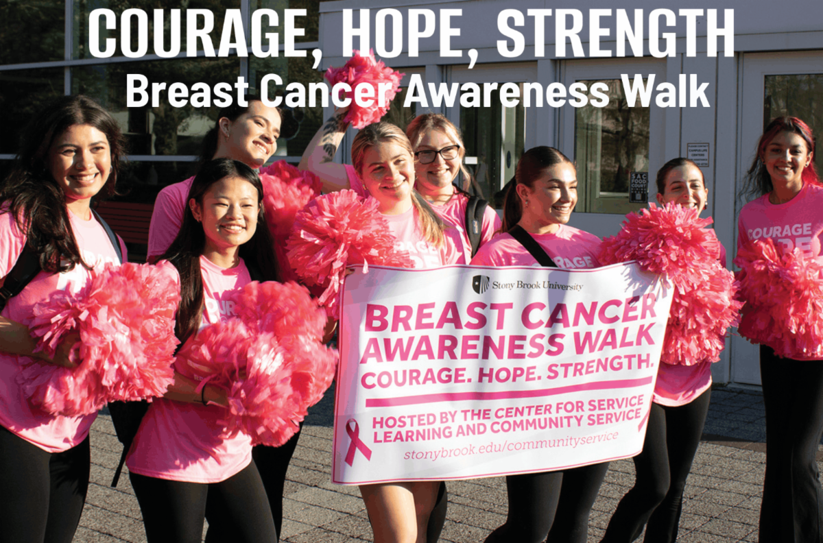 girls hold pink pom poms with a sign that says BREAST CANCER AWARENESS WALK, Courage, Hope, Strength