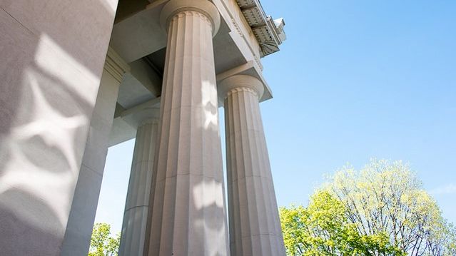 Pillard of Bush Memorial Hall against blue sky