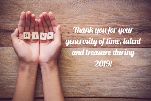 The word  GIVE  in hands in cupped shape. Concepts of sharing_ giving_