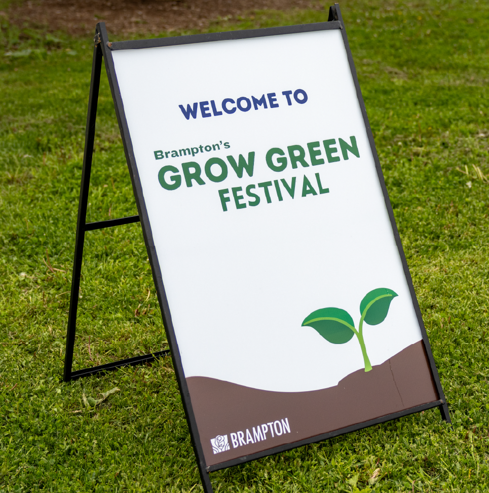 Sign on grass reading “Welcome to Brampton’s Grow Green Festival.”