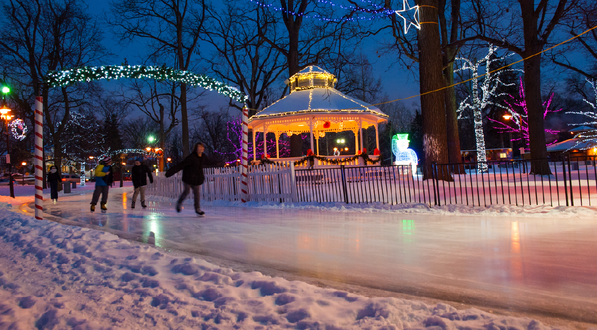 People skating at Gage Park at night
