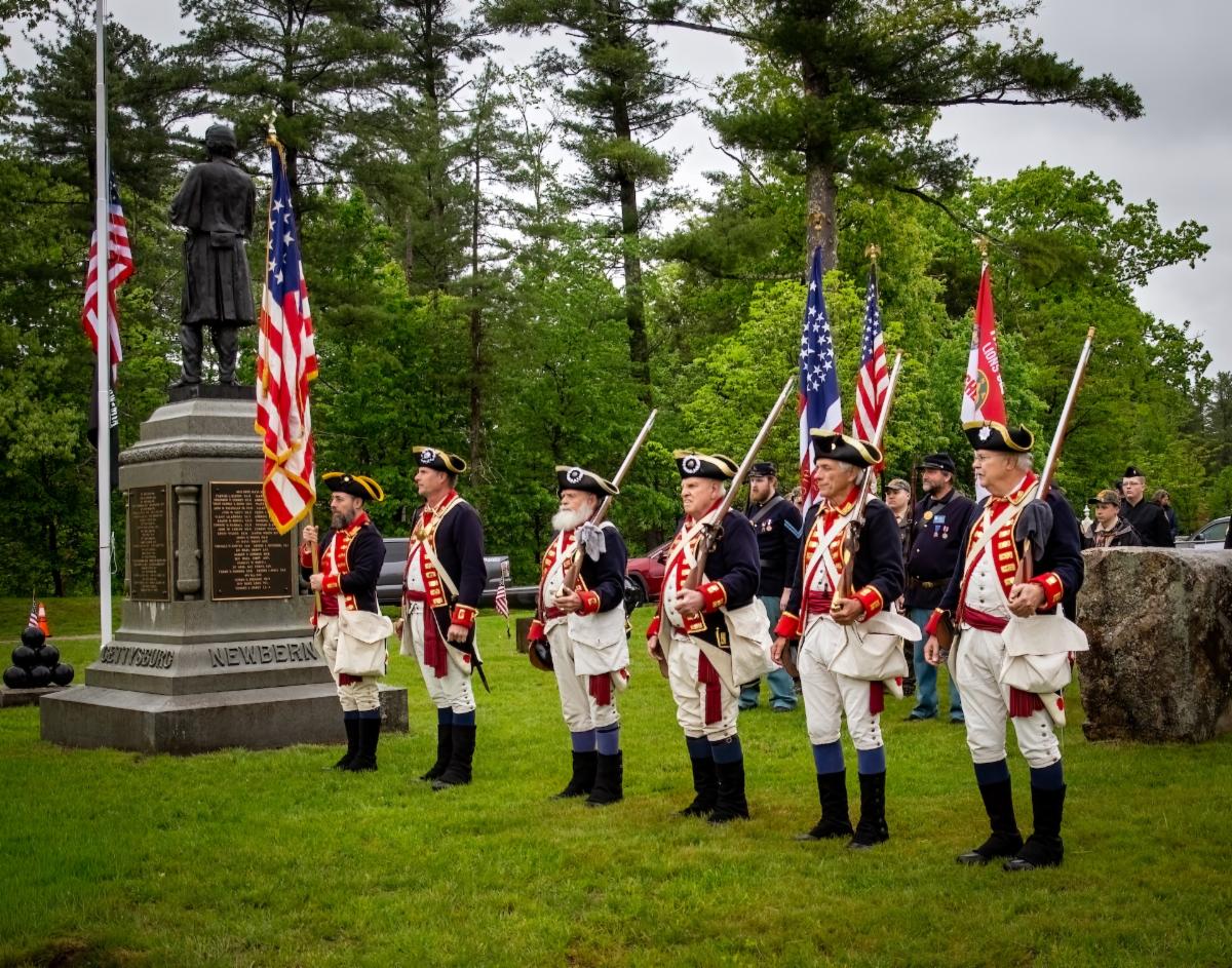 Photo of men dressed in Revolutionary War costume standing at Quabbin Park Memorial Day Ceremony