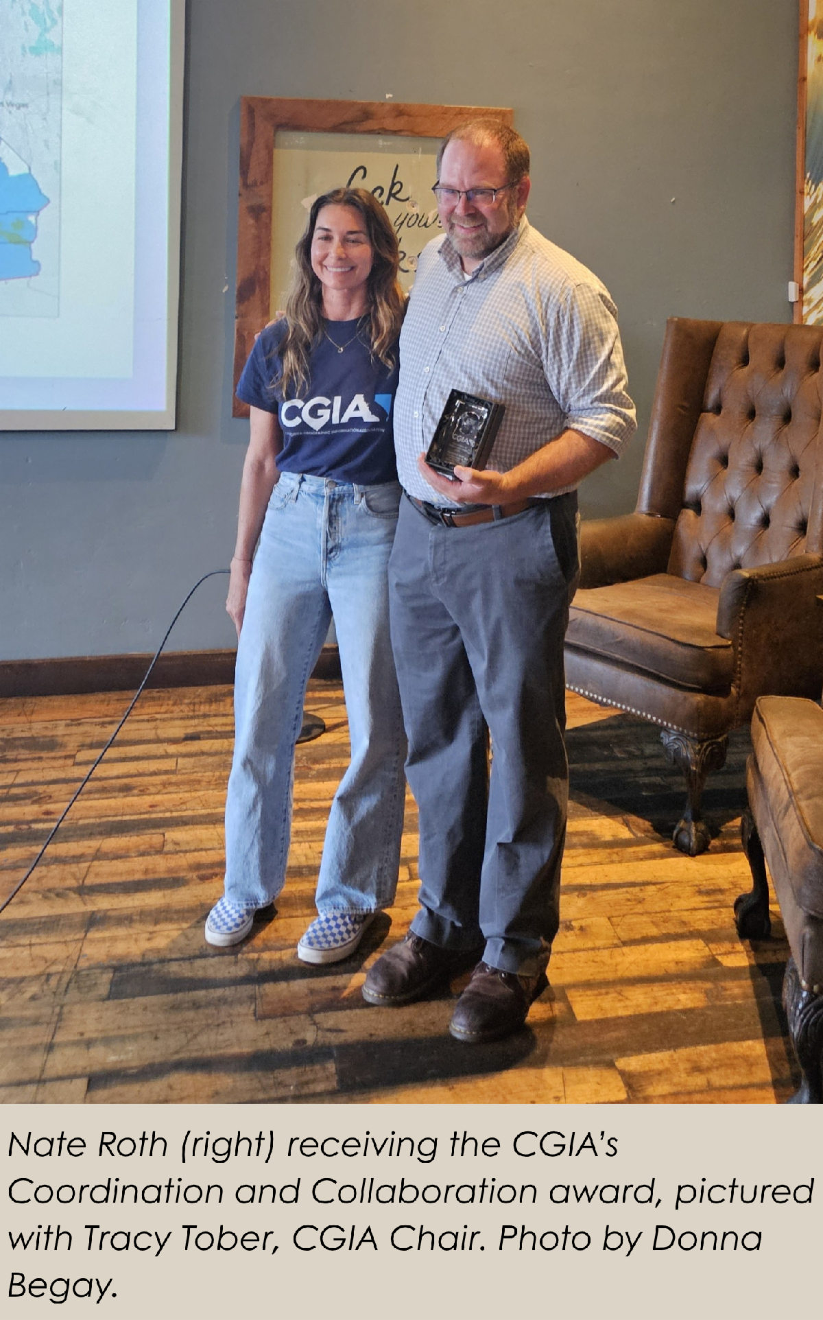Nate Roth (right) receiving the CGIA’s Coordination and Collaboration award, pictured with Tracy Tober, CGIA Chair. Photo by Donna Begay.