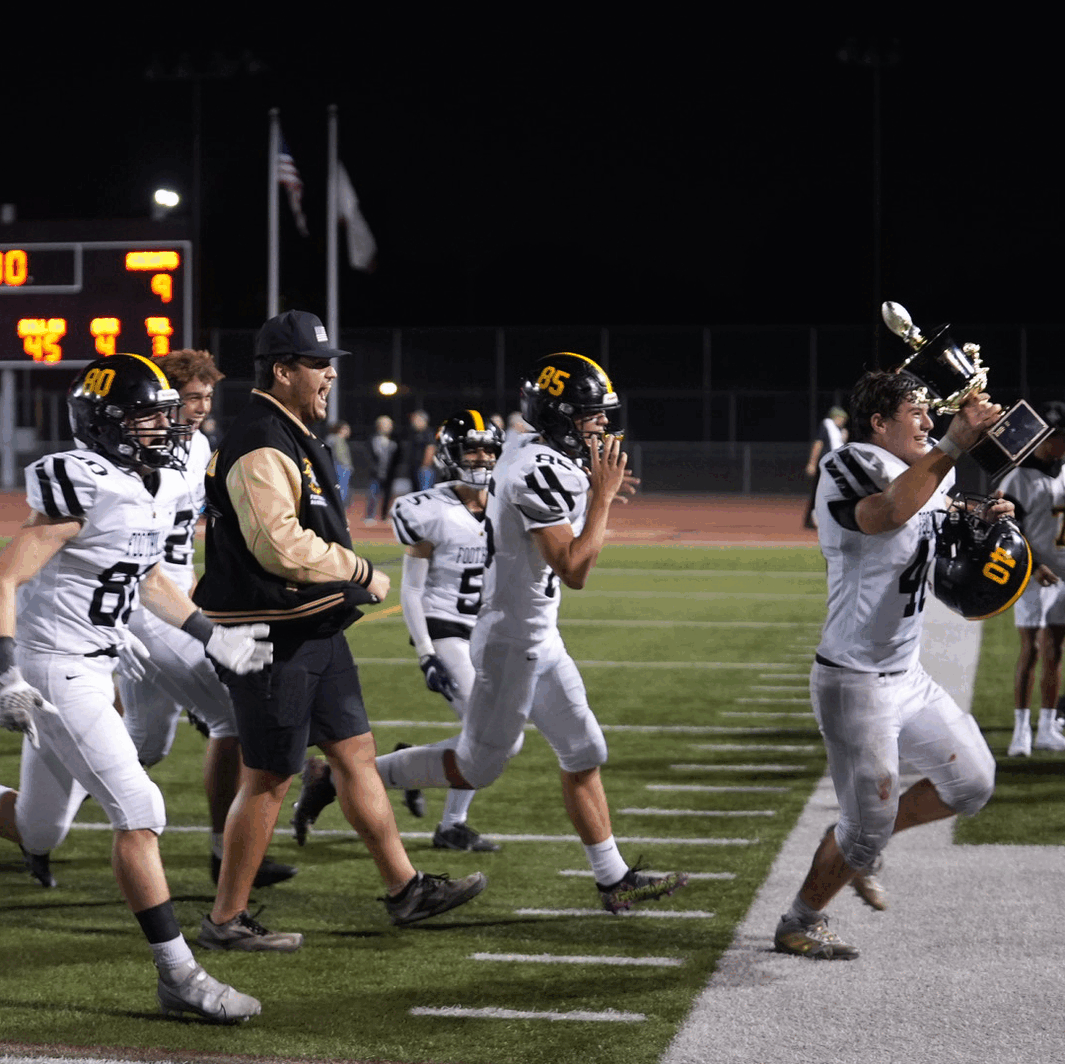 Foothill Knights celebrate with trophy following win over Tustin