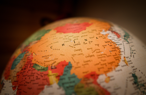 Globe with map of China. Photo by Christian Lue on Unsplash