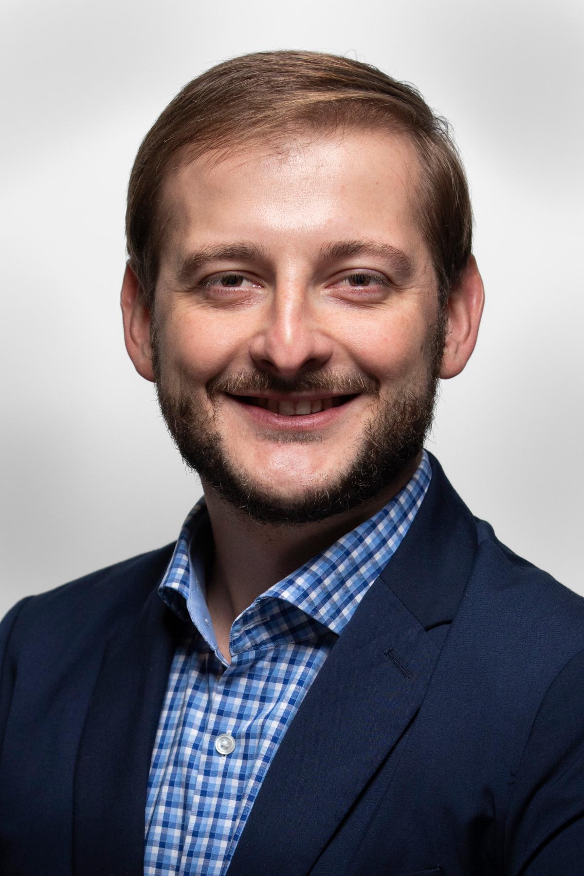 Portrait photo of Elvis Elli against a white background