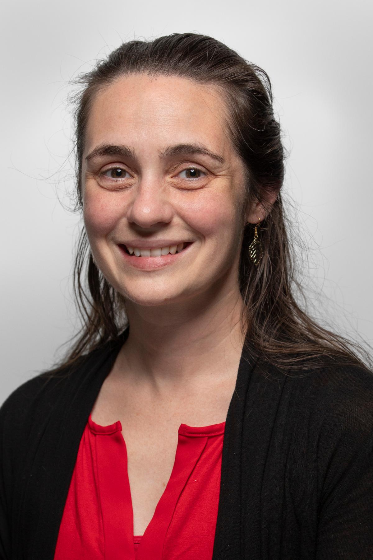 Portrait photo of Natalie Clay against a white background