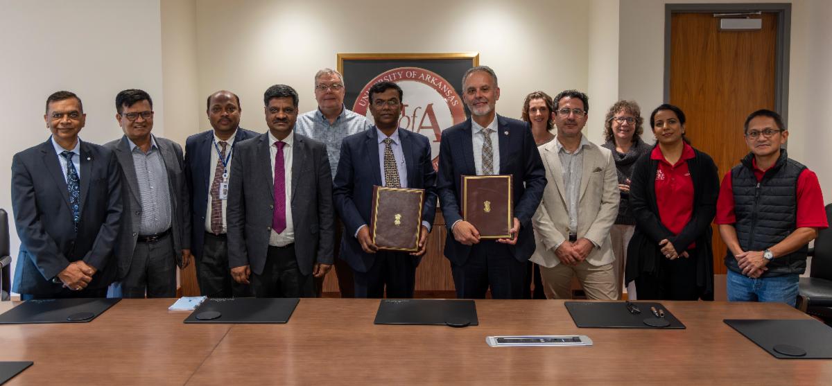 Group of people are taking a photo after a conference.