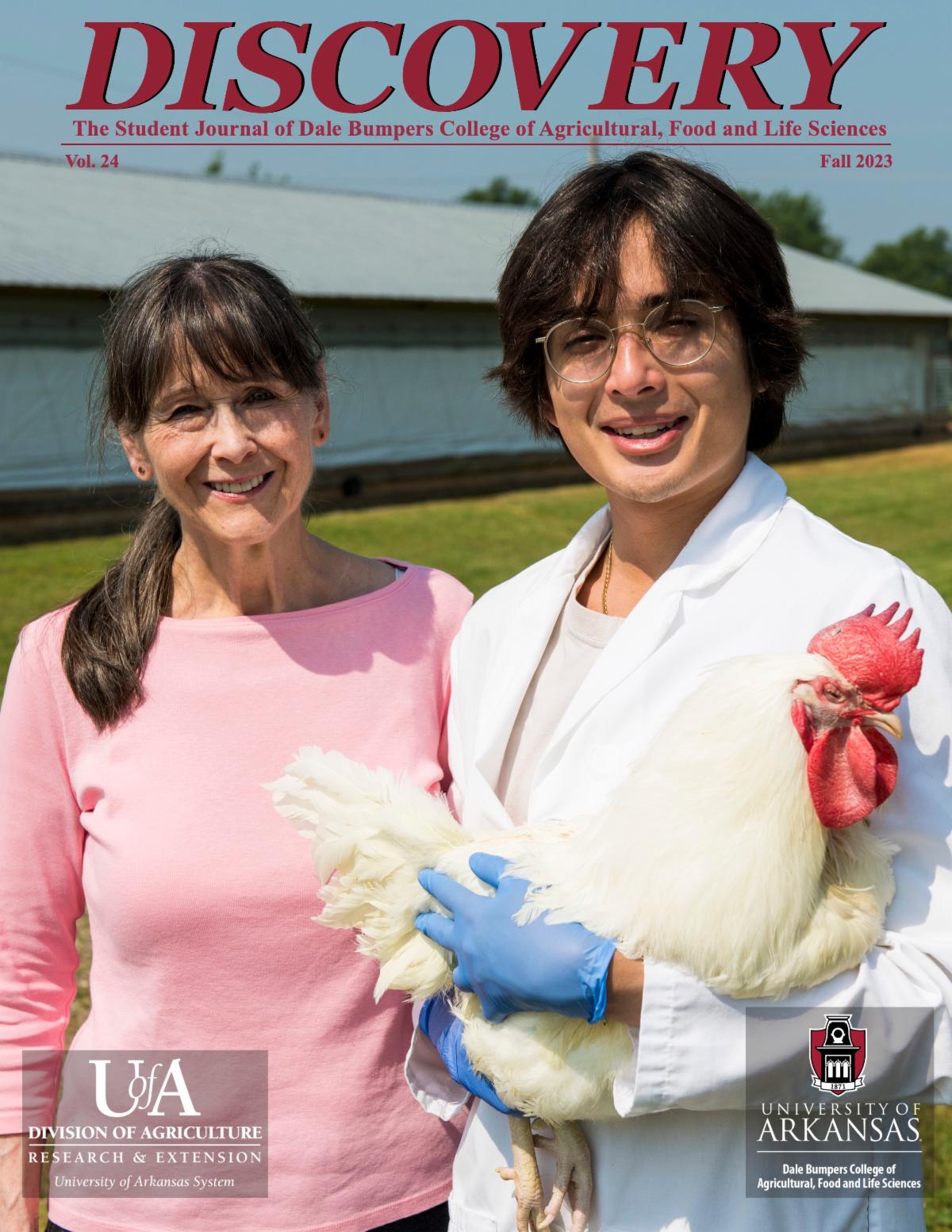 Cover of the 2023 Discovery journal featuring Gisela Erf and Alessandro Rocchi holding a chicken