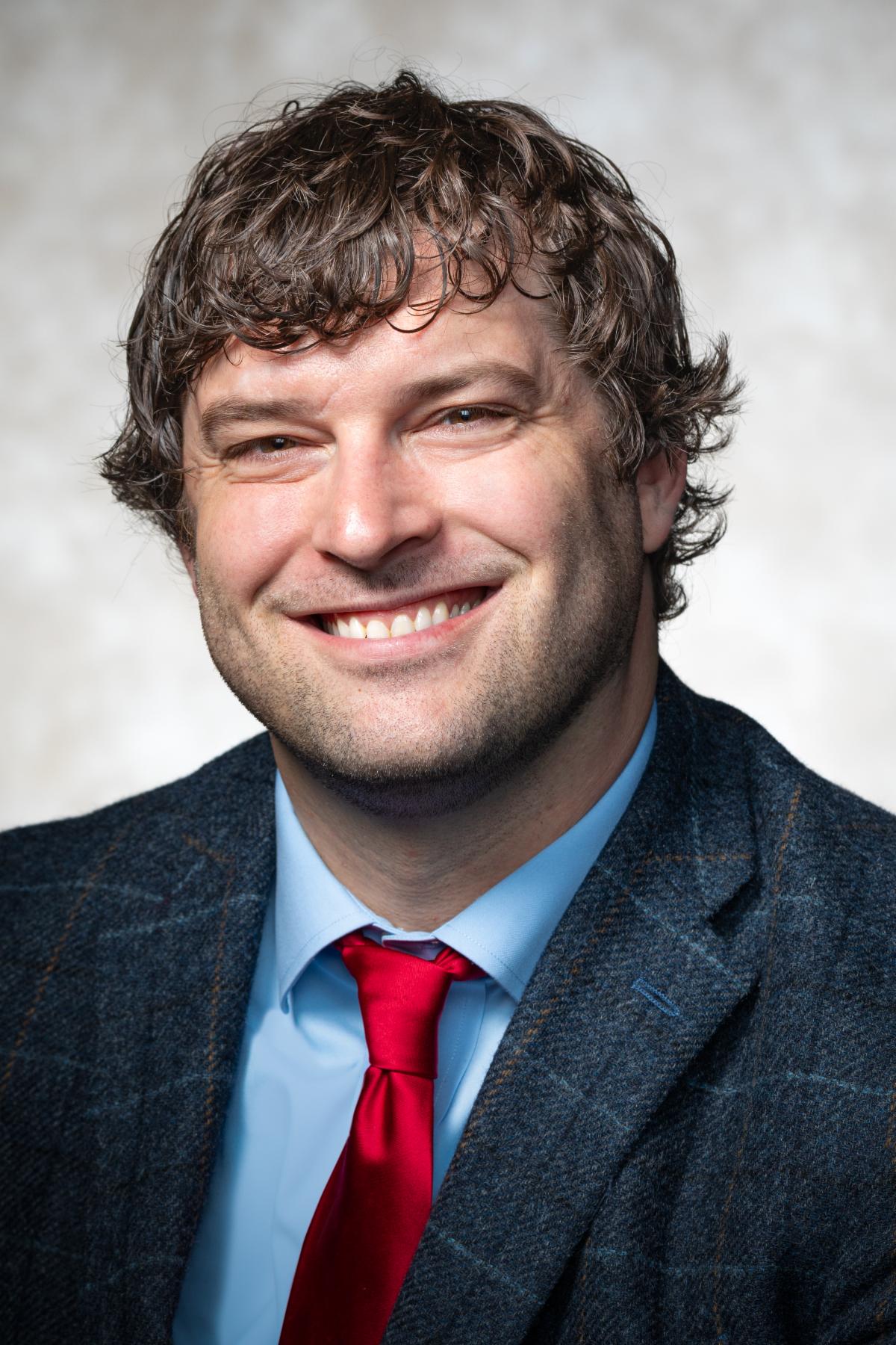 Portrait photo of Trey Malone