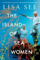 Book Cover of The Island of Sea Women by Lisa See. Two Asian women in diving uniforms stand atop a rocky outcrop in the sea.