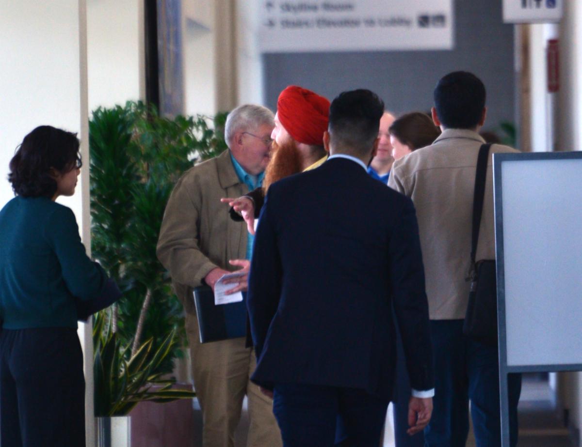 Attendees talking and networking between sessions
