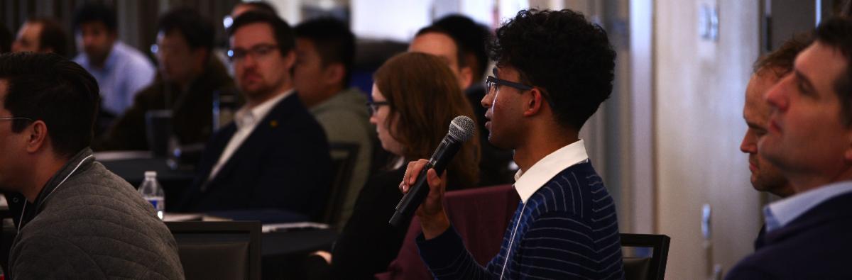 Q&A session — audience member asking a question or panel discussion