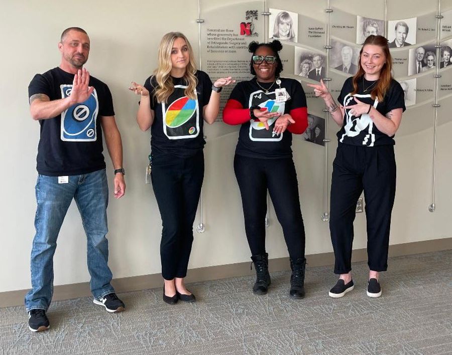 Dermatology staff in UNO Card Game Halloween costumes.