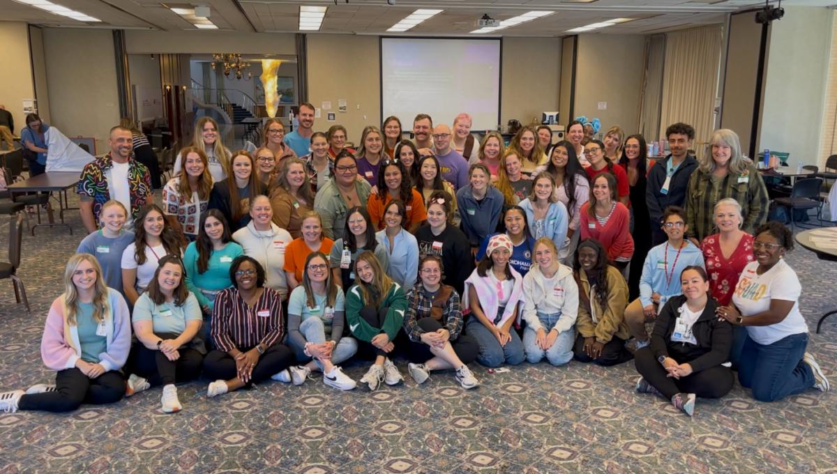 Dermatology clinic staff pose for a group photo during their fall retreat.