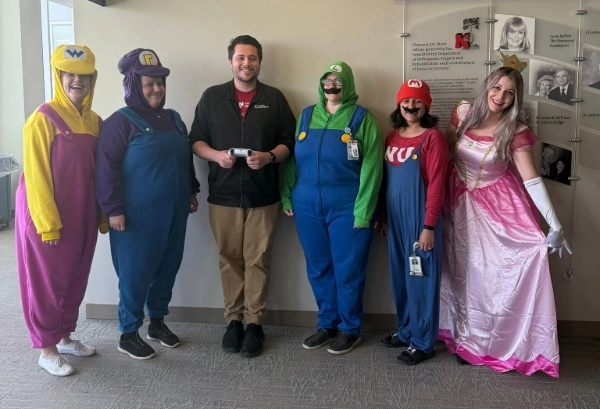 Dermatology staff in Mario Kart Halloween costumes.