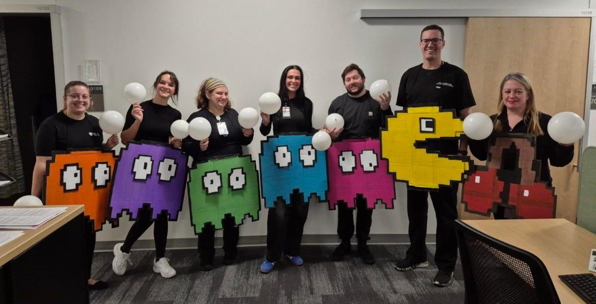 Dermatology staff in Pac Man Halloween costumes.
