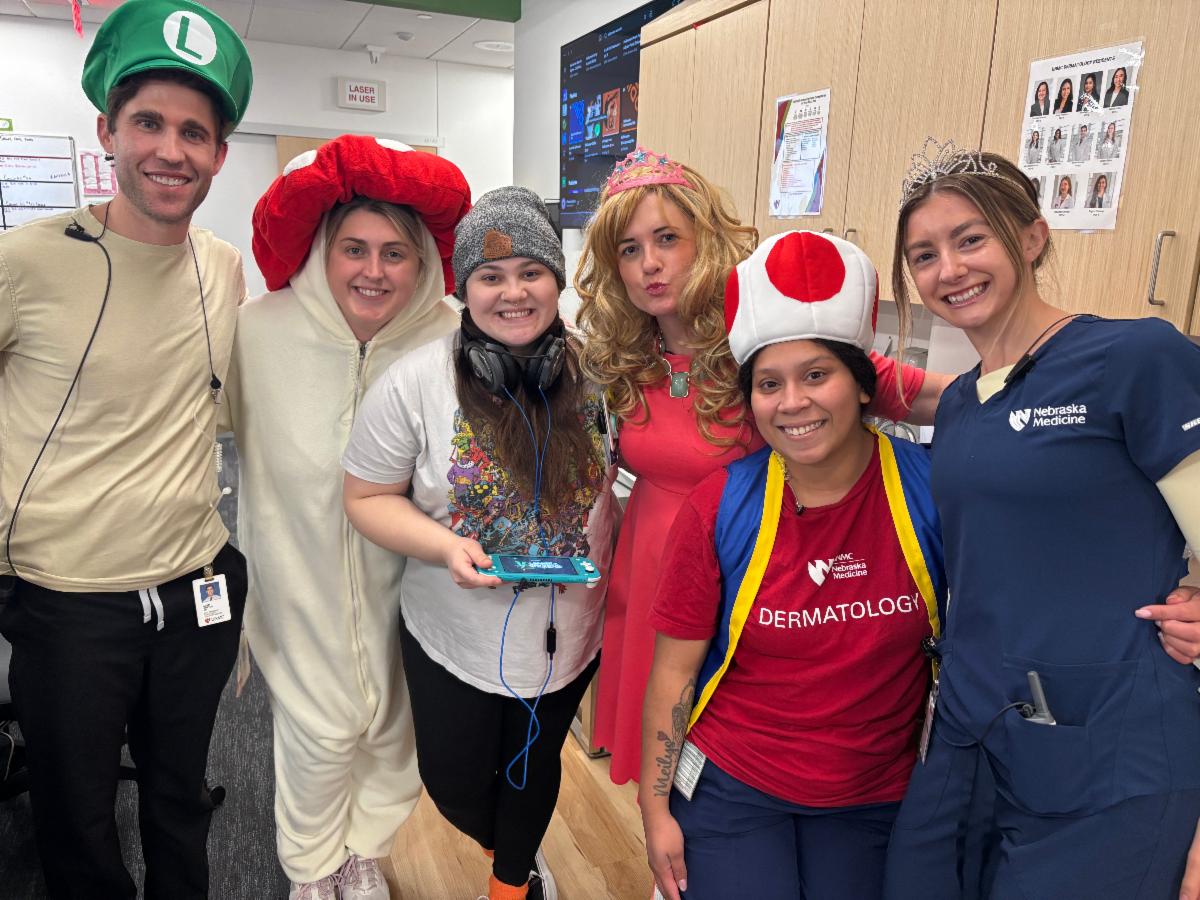 Dermatology staff in Mario Halloween costumes.