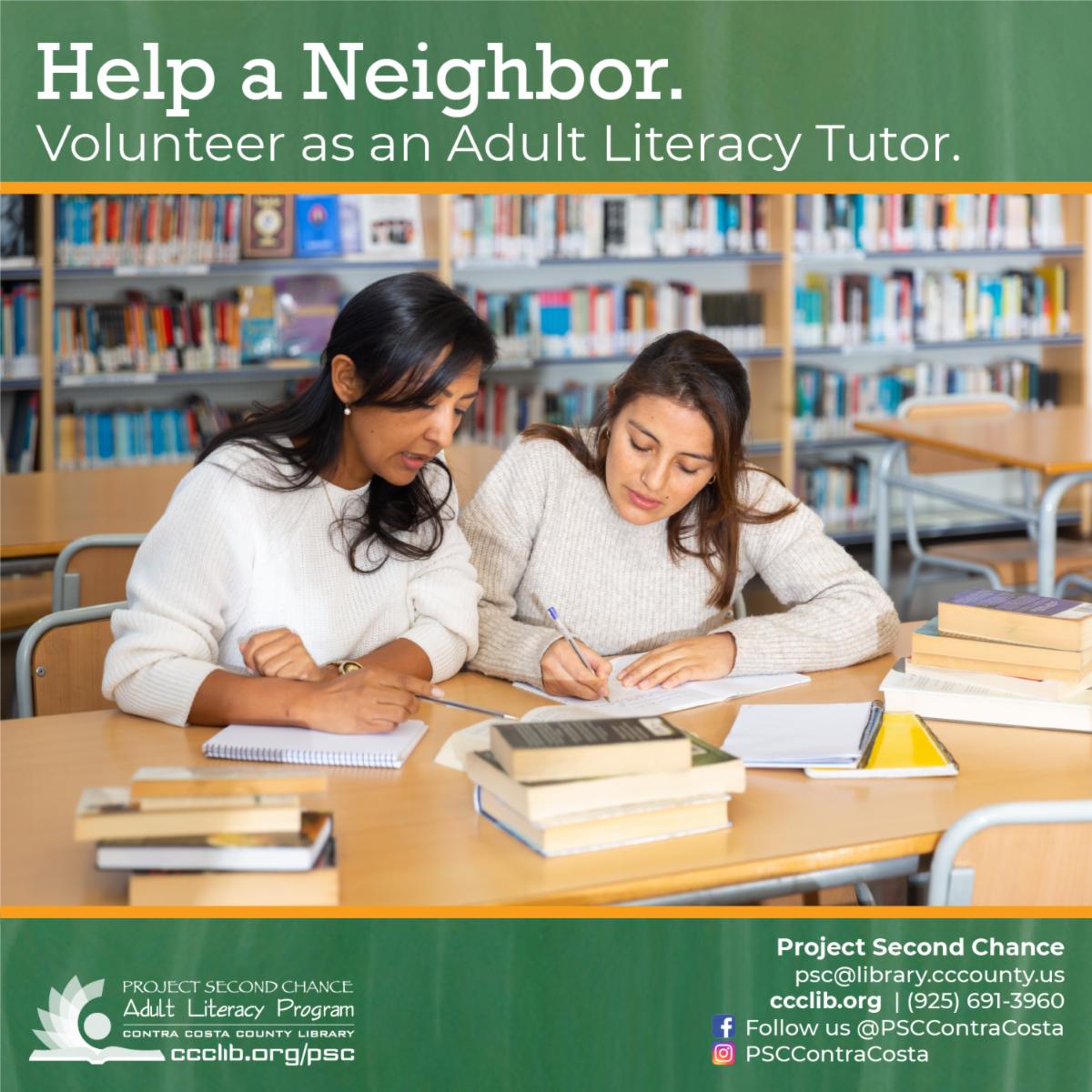 photo of one woman helping another woman with writing at a library