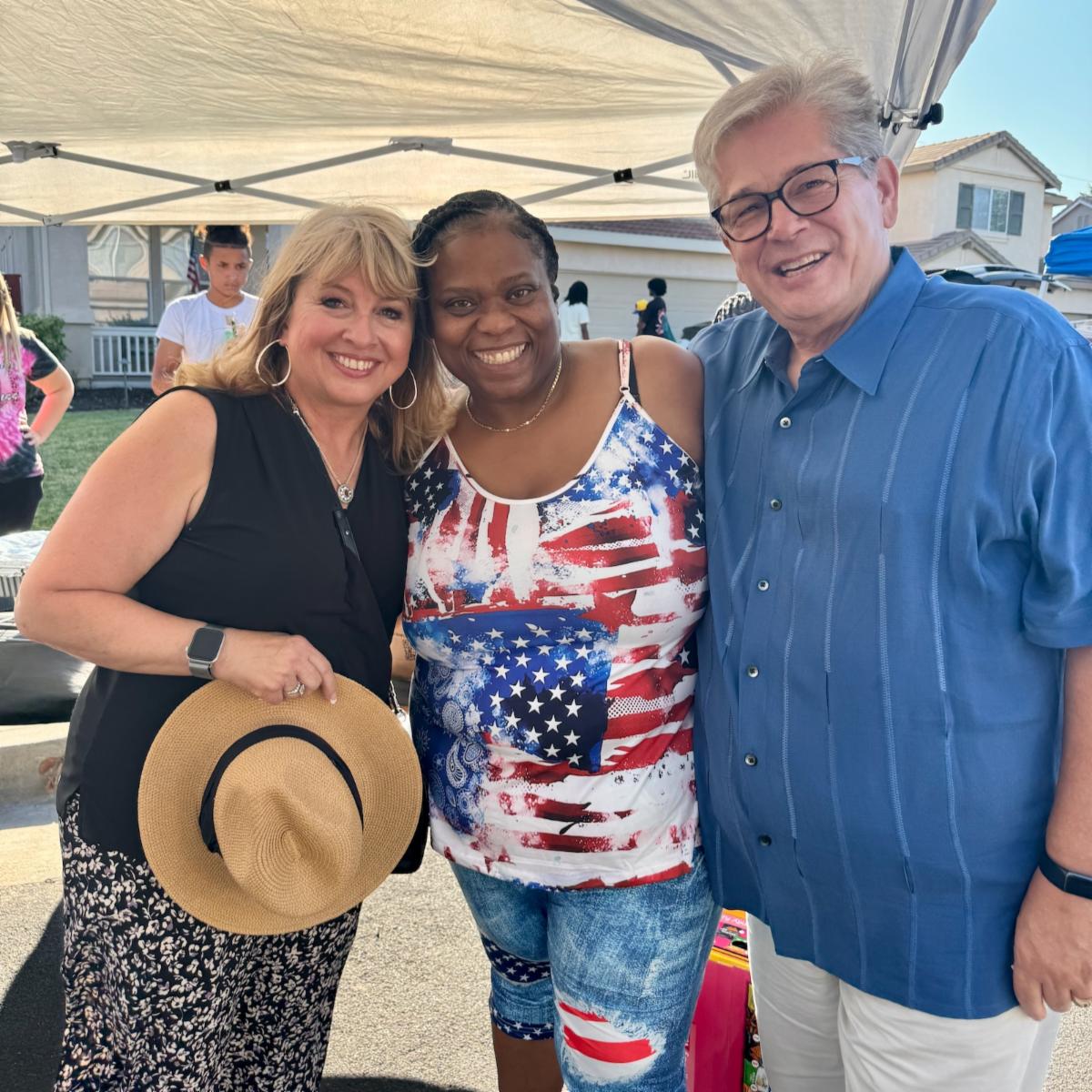 Supervisor Burgis posing with Velma Wilson and Don Freitas