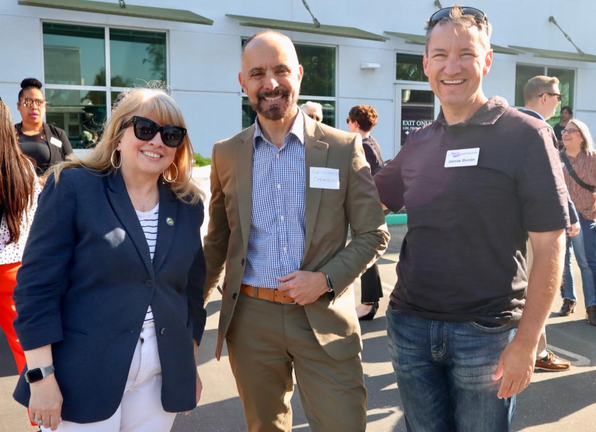 Supervisor Burgis posing outside with Christopher Cabaldon and Jamie Duran