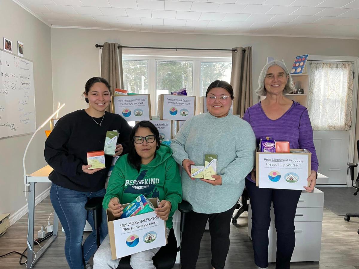 A group of women receiving menstrual supplies from Moon Time Connections in March 2024.