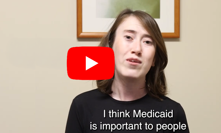 A person speaks to the camera indoors with a video play button overlay. On-screen caption reads, âI think Medicaid is important to people.â
