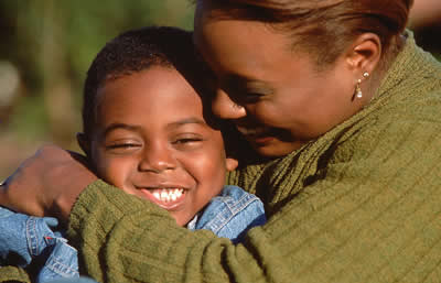 Mother hugging son