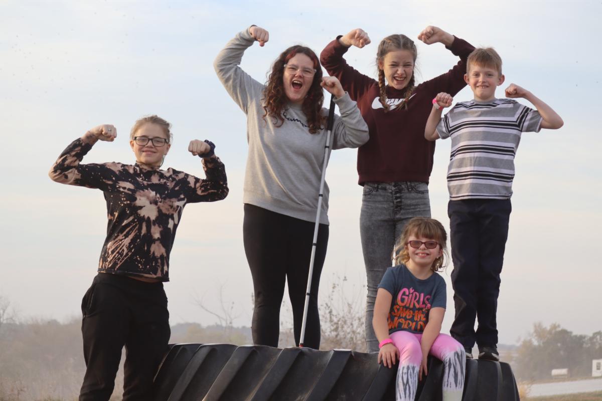 Five students pump their arms