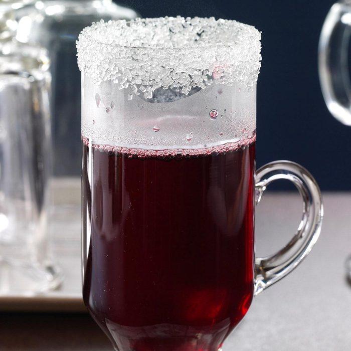 Red punch in a clear mug