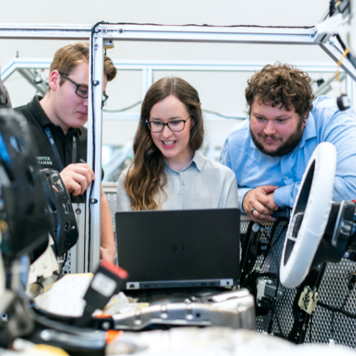 Engineering students working in front of computer in lab