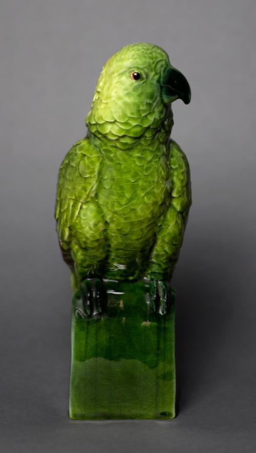 Photo of a green ceramic parrot