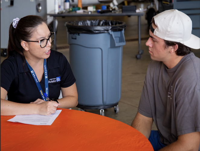 United Aviate Recruiter discussing career options with Aviation student.