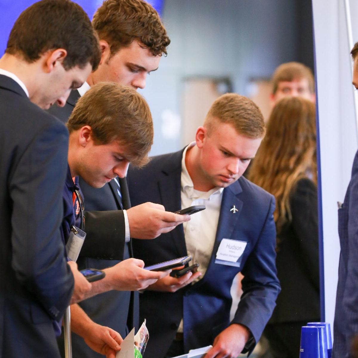 Students at Career Fair scanning a QR code for more information.