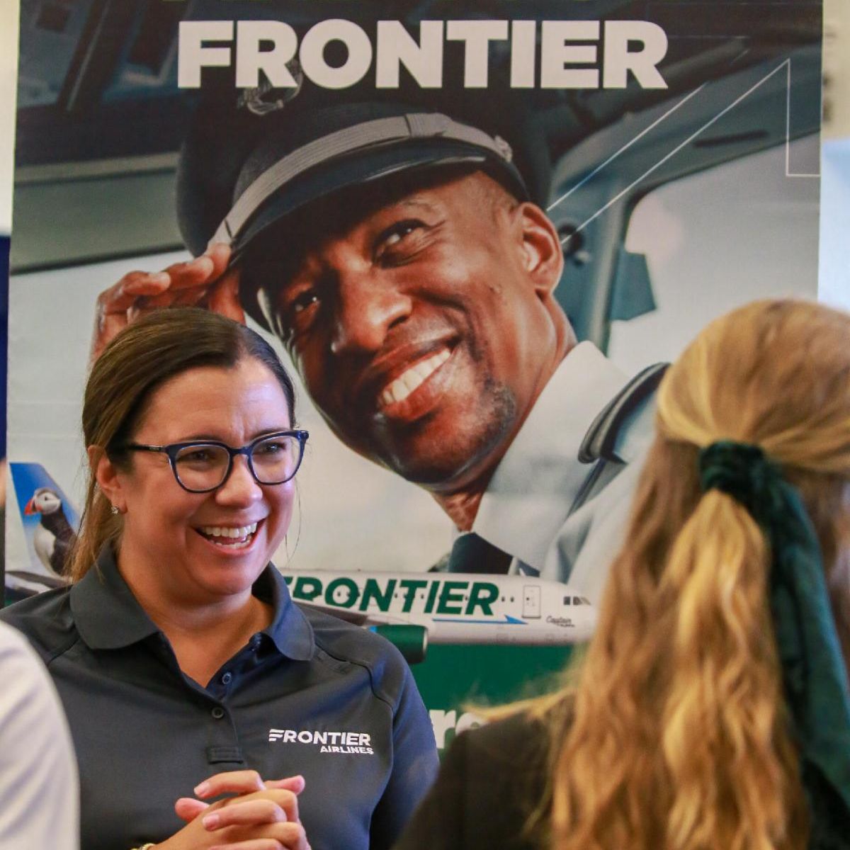 Frontier Air Lines Ambassador talking to students about the new pathway program