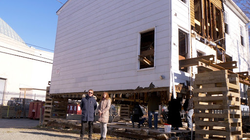 Mayor Buckley and Laura Houston (Preservation Maryland) on the day the Burtis House was lifted. 