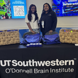 Dr. Tyler Evans (left) and Dr. Jessica Stone  at a Dallas Mavericks game