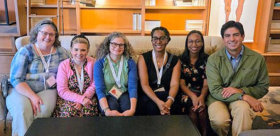 staff member and doctors on a couch