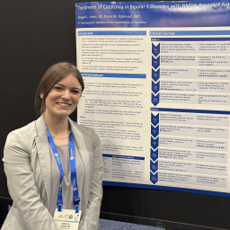 Woman in front of poster