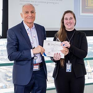 Reagan Volzer accepts her Rising Star award from Dr. Robert Toto, M.D.