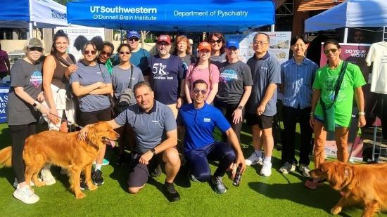 A group of volunteers poses at the UTSW tent at NAMIWalks North Texas.
