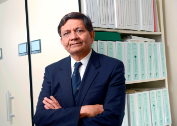 A photo of Dr. Madhukar Trivedi in a research library